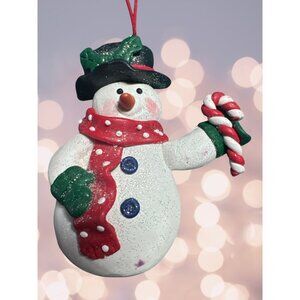 Hand Made Snowman Ornament carrying a Candy Cane and the Cutest Face and Hat